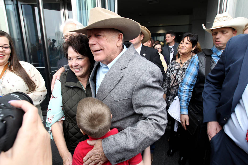 Cliven Bundy hugs his wife, Carol after walking out of Lloyd George U.S. Courthouse in Las Vegas a free man Monday, Jan. 8, 2017, after a federal judge dismissed the case with prejudice against hi ...