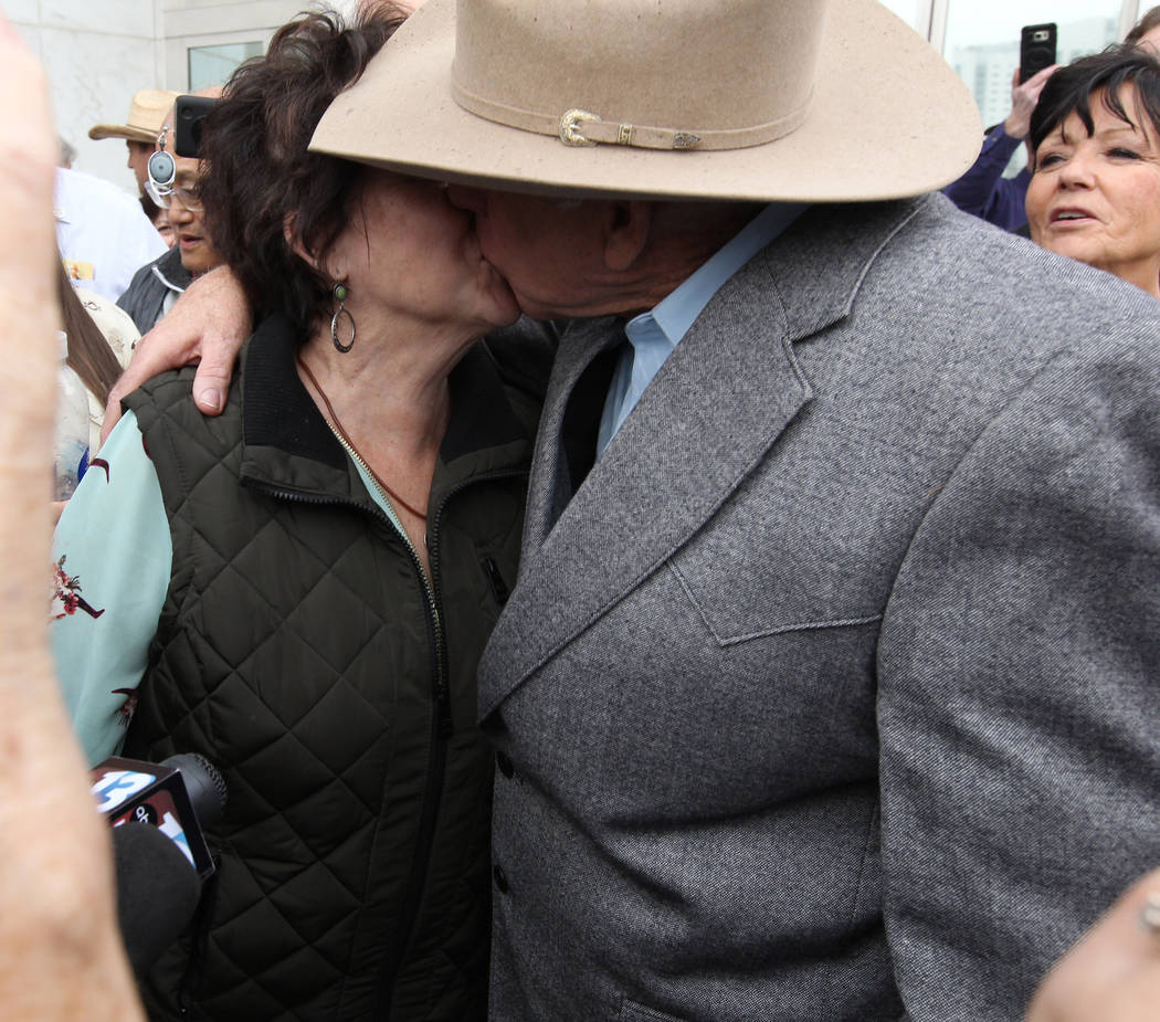 Cliven Bundy kisses his wife, Carol after walking out of Lloyd George U.S. Courthouse in Las Vegas a free man Monday, Jan. 8, 2017, after a federal judge dismissed the case with prejudice against ...
