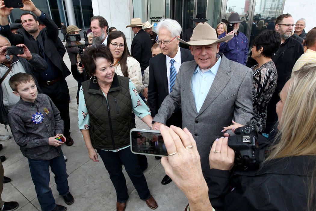 Cliven Bundy walks out of Lloyd George U.S. Courthouse in Las Vegas a free man with his wife Carol Monday, Jan. 8, 2017, after a federal judge dismissed the case with prejudice against him, two of ...