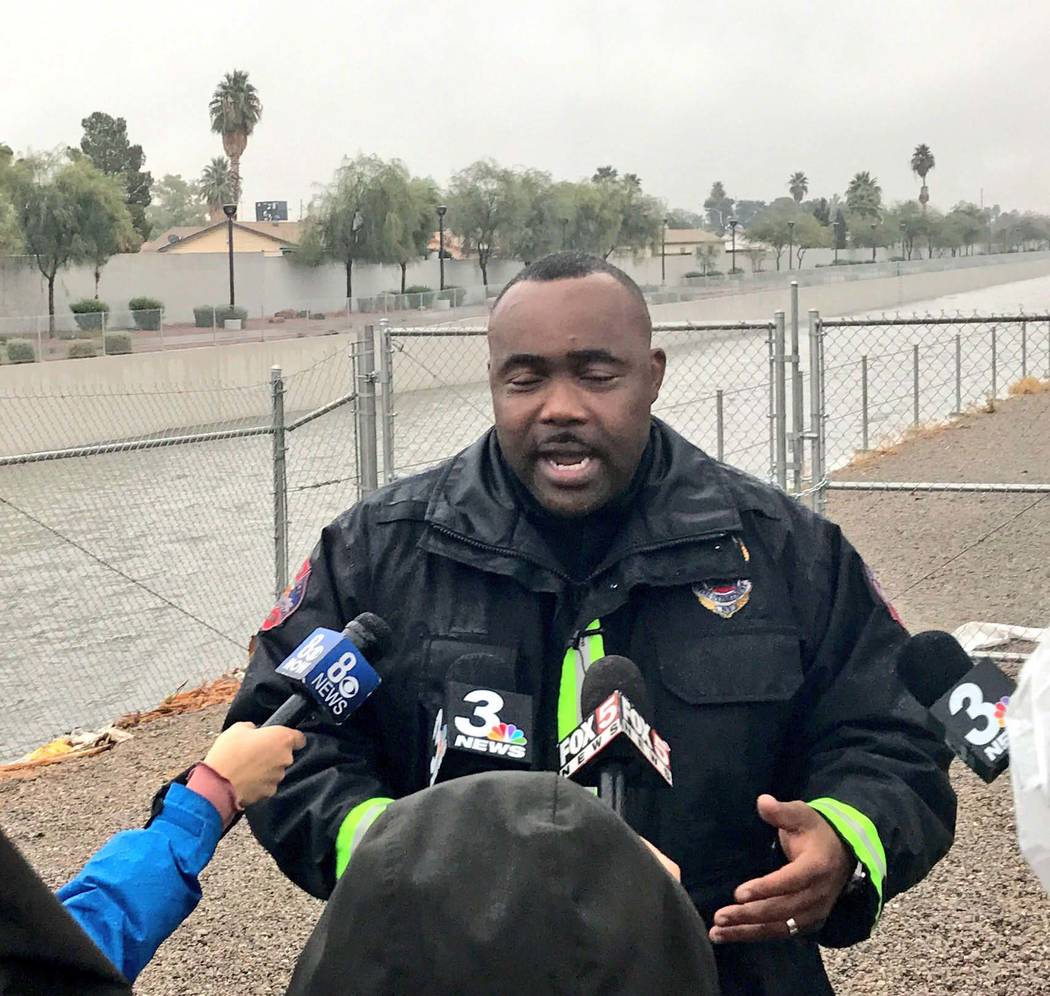 North Las Vegas Capt. Cedric Williams speaks to the media after a swift-water rescue near Carey Avenue and Pecos Road, Tuesday, Jan. 9, 2018. (Rachel Crosby/Las Vegas Review-Journal)
