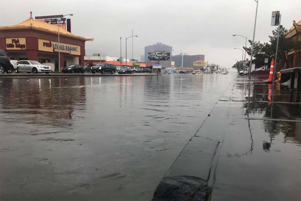Rainwater floods the street in the 3700 block of West Spring Mountain Road, Tuesday, Jan. 9, 2018. (Elaine Wilson/Las Vegas Review-Journal)