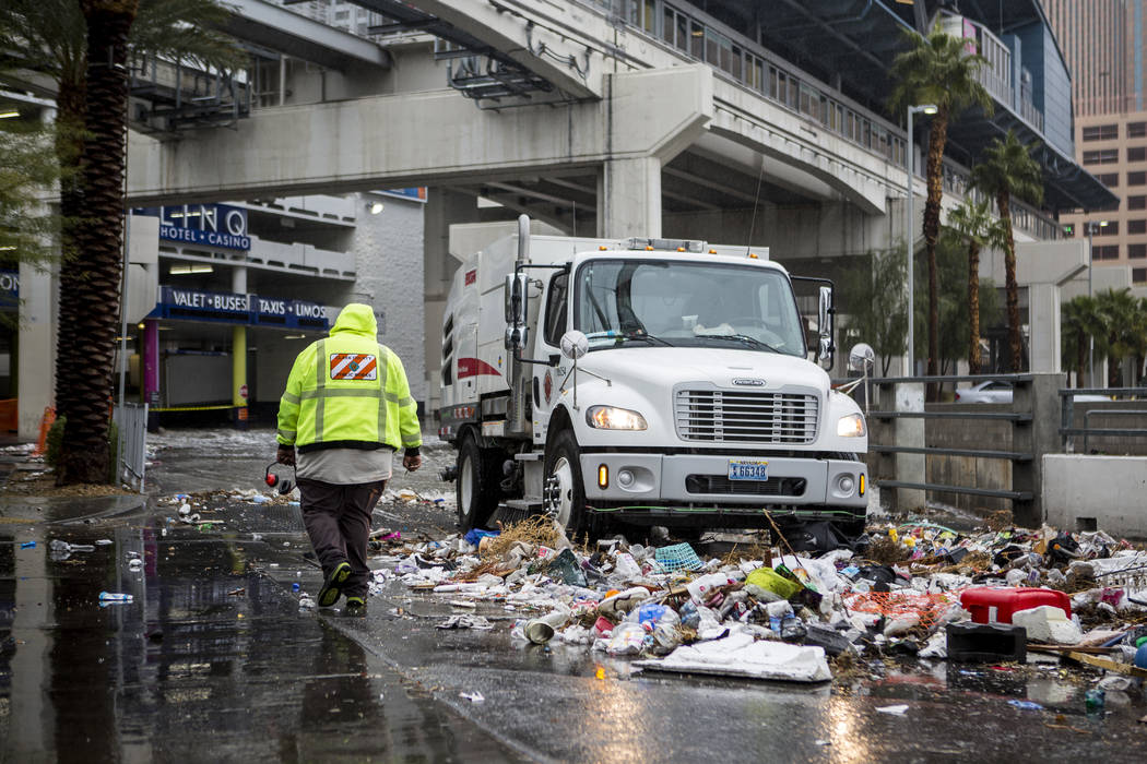 A Clark County Public Works crew cleans up debris swept away by floodwaters near The Linq Hotel in Las Vegas on Tuesday, Jan. 9, 2018. (Patrick Connolly/Las Vegas Review-Journal) @PConnPie