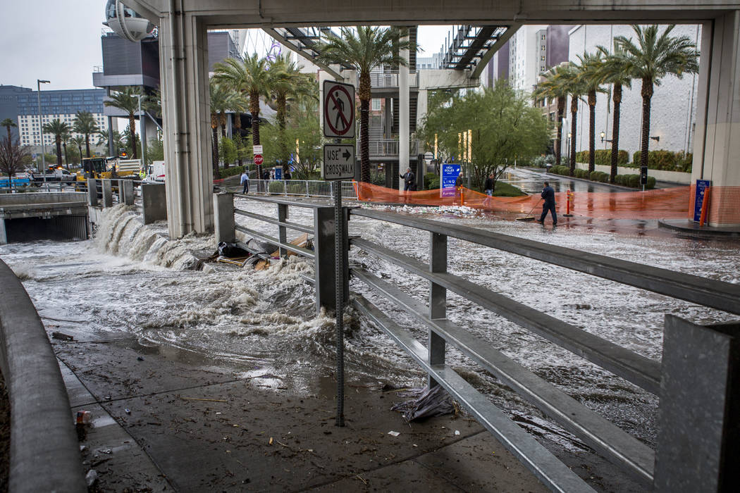 Water rushes into in a flood channel near The Linq Hotel in Las Vegas on Tuesday, Jan. 9, 2018. (Patrick Connolly/Las Vegas Review-Journal) @PConnPie