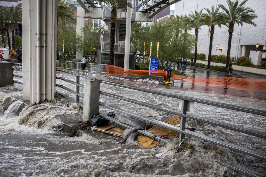 Water rushes into in a flood channel near The Linq Hotel in Las Vegas on Tuesday, Jan. 9, 2018. (Patrick Connolly/Las Vegas Review-Journal) @PConnPie