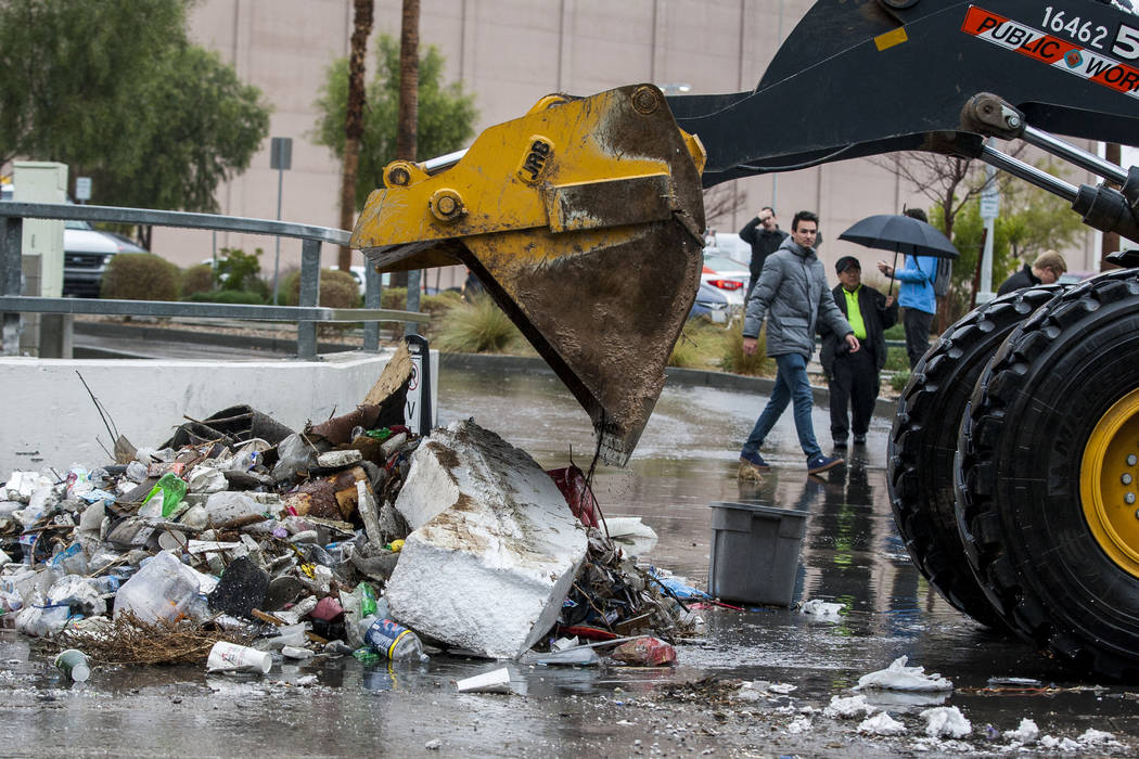 Clark County Public Works crews clears debris resulting from floodwaters near The Linq Hotel in Las Vegas on Tuesday, Jan. 9, 2018. (Patrick Connolly/Las Vegas Review-Journal) @PConnPie