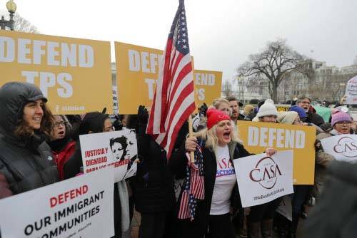 CASA de Maryland, an immigration advocacy and assistance organization, holds a rally in Lafayette Park, across from the White House in Washington, Monday, Jan. 8, 2018, in reaction to the announce ...