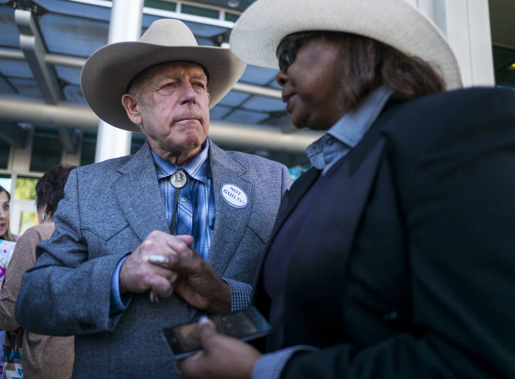 Rancher Cliven Bundy speaks with supporter Annette Walker-Goggins after addressing supporters and journalists at Metropolitan Police Department headquarters on Wednesday, Jan. 10, 2018, in Las Veg ...