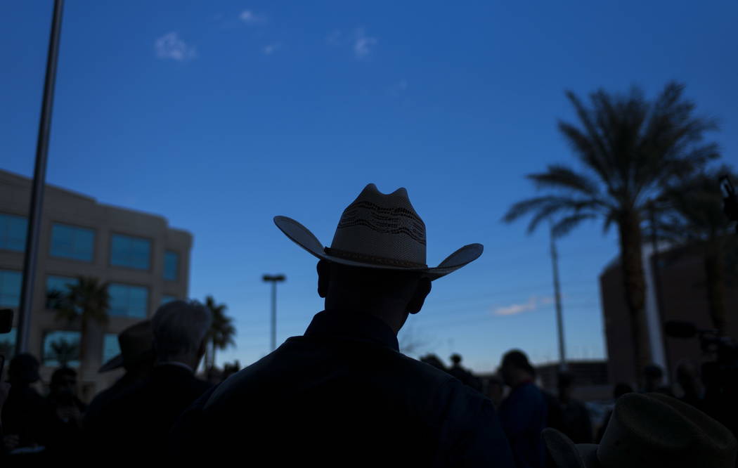 Ryan Bundy, son of rancher Cliven Bundy, listens to his father speak at Metropolitan Police Department headquarters on Wednesday, Jan. 10, 2018. Chase Stevens Las Vegas Review-Journal @csstevensphoto