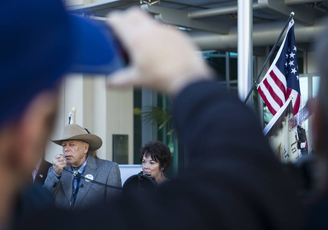 Rancher Cliven Bundy, standing next to his wife Carol, address supporters and journalists at Metropolitan Police Department headquarters on Wednesday, Jan. 10, 2018. Chase Stevens Las Vegas Review ...