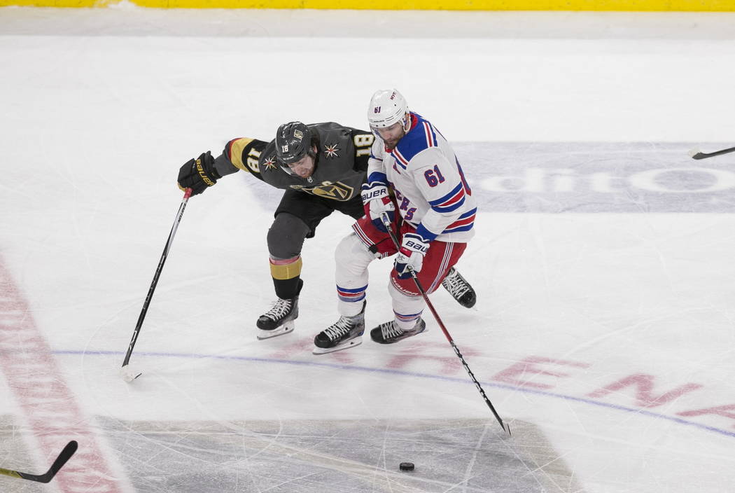Vegas Golden Knights left wing James Neal (18) pressures New York Rangers right wing Rick Nash (61) during the second period of an NHL hockey game between the Vegas Golden Knights and the New York ...