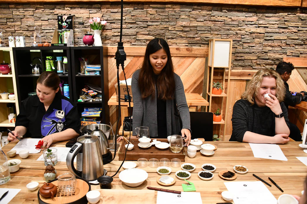 Rie Tulali, a tea teacher and general manager at Tealet, U.S. leader of tea growers, talks to her students about Chinese tea during the Jan. 9 class. Tea and Whisk hosted several classes about dif ...