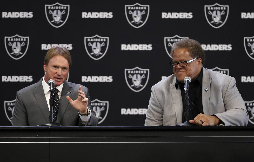 Oakland Raiders new head coach Jon Gruden, left, answers a question next to general manager Reggie McKenzie during an NFL football press conference Tuesday, Jan. 9, 2018, in Alameda, Calif. (AP Ph ...