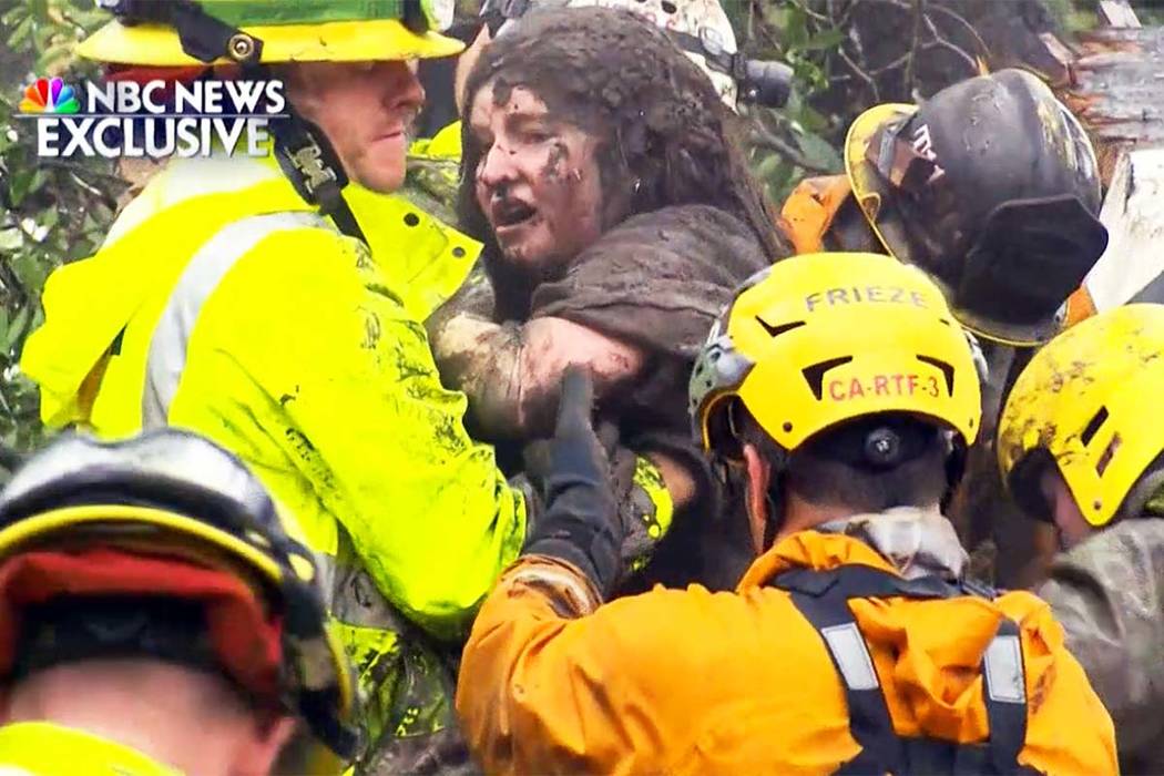 This frame from video provided by NBC News shows the rescue of a 14-year-old girl from the wreckage of a home after heavy rains trapped dozens of people in Montecito, Calif., Tuesday, Jan. 9, 2018 ...