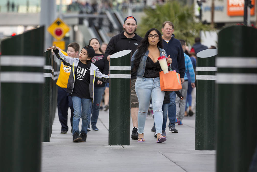 People walk past recently installed safety bollard on the Vegas Strip on Tuesday, January 2, 2018. Richard Brian Las Vegas Review-Journal @vegasphotograph