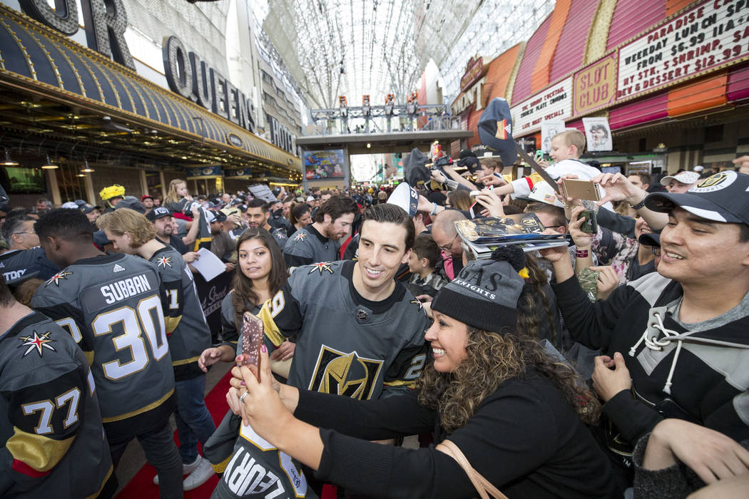 Vegas Golden Knights goaltender Marc-Andre Fleury (29) poses with a fan during the team's first fan fest at the Fremont Street Experience in downtown Las Vegas on Sunday, Jan. 14, 2018. Richard Br ...
