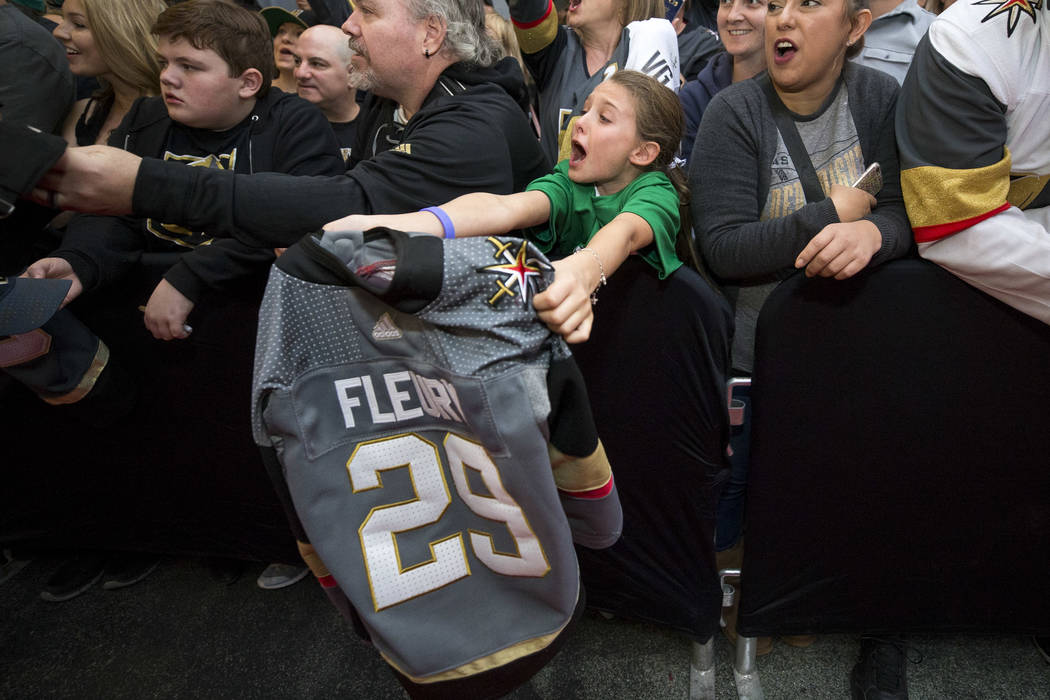 Henderson resident Isabella Lewis, 9, screams for Vegas Golden Knights goaltender Marc-Andre Fleury during the team's first fan fest at the Fremont Street Experience in downtown Las Vegas on Sunda ...