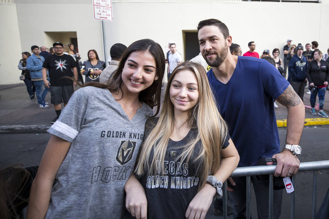 Vegas Golden Knights defenseman Deryk Engelland, right, poses with fans during the team's first fan fest at the Fremont Street Experience in downtown Las Vegas on Sunday, Jan. 14, 2018. Richard Br ...