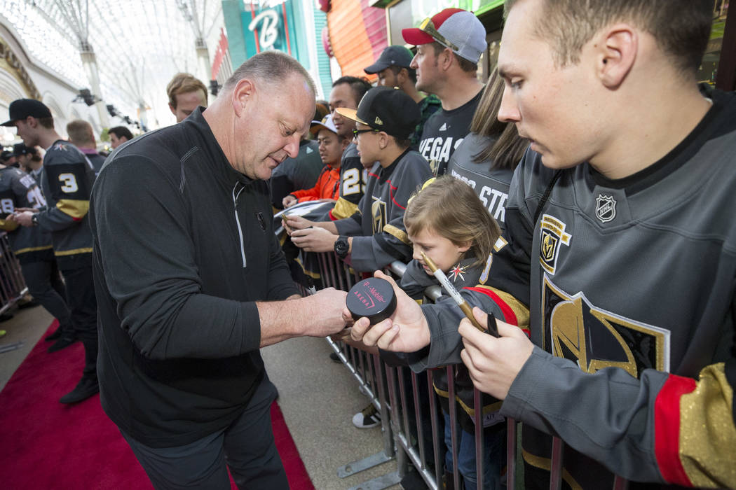 Vegas Golden Knights head coach Gerard Gallant signs autographs during the team's first fan fest at the Fremont Street Experience in downtown Las Vegas on Sunday, Jan. 14, 2018. Richard Brian Las ...