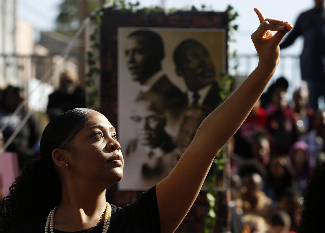 an Alpha Kappa Alpha Sorority member performs for the 36th annual Dr. Martin Luther King Jr. Parade, themed "Living the Dream: Building a Bridge to Unity" in downtown Las Vegas, Jan. 15, 2018. The ...