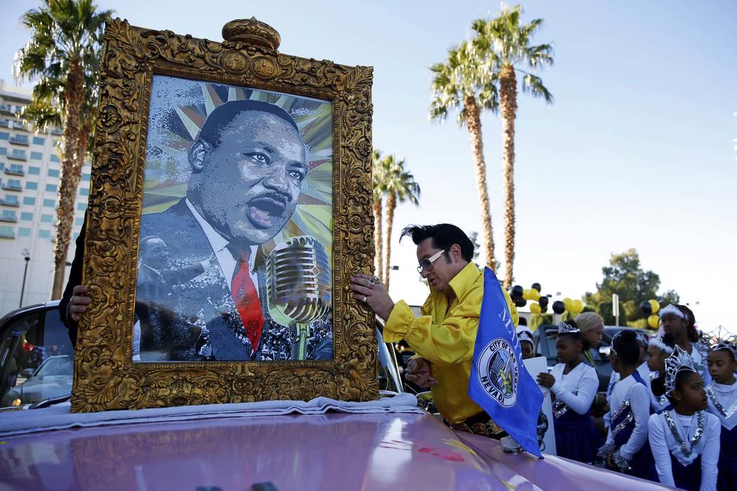 Jesse Garon prepares for the 36th annual Dr. Martin Luther King Jr. Parade, themed "Living the Dream: Building a Bridge to Unity," in downtown Las Vegas, Jan. 15, 2018. The parade featured floats, ...