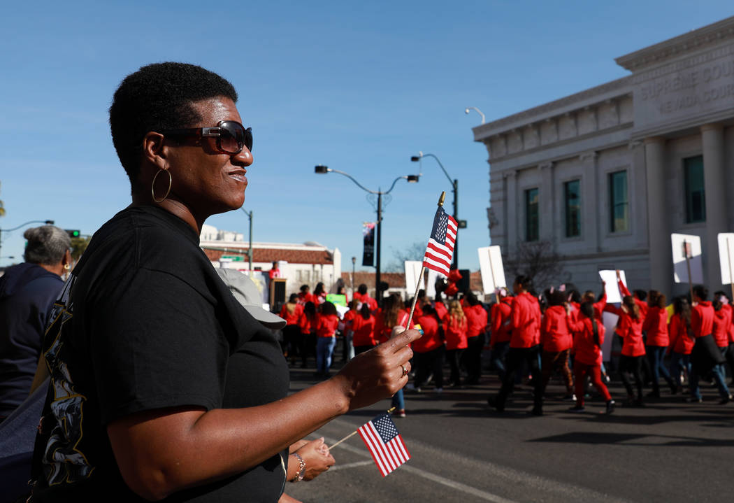 Angela Henderson watches the 36th annual Dr. Martin Luther King Jr. Parade, themed "Living the Dream: Building a Bridge to Unity," in downtown Las Vegas, Jan. 15, 2018. The parade featured floats, ...