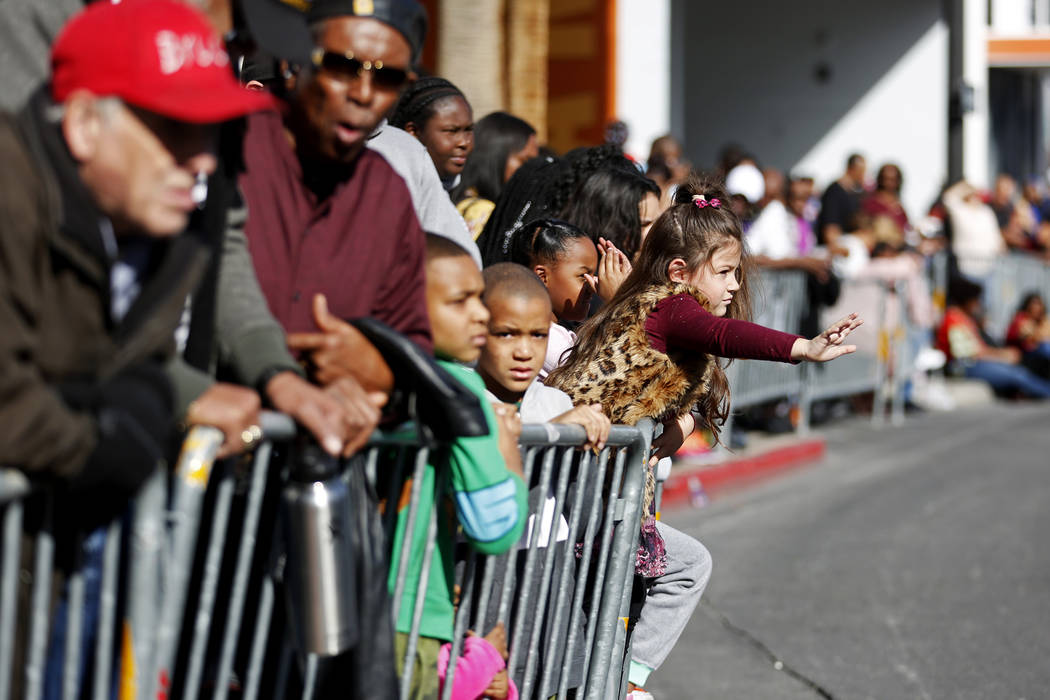 Attendees watch the 36th annual Dr. Martin Luther King Jr. Parade, themed "Living the Dream: Building a Bridge to Unity," in downtown Las Vegas, Jan. 15, 2018. The parade featured floats, dancers, ...