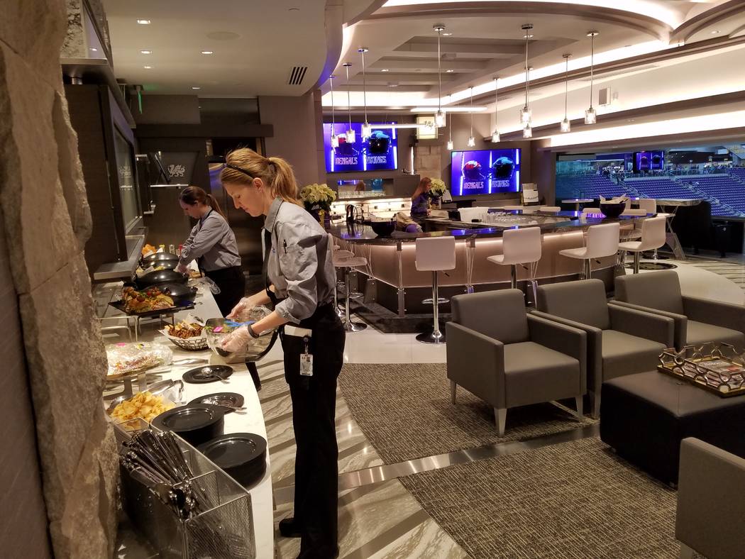 Food servers prepare a buffet in one of U.S. Bank Stadium's 131 luxury  suites on Sunday, Dec. 17, 2017, prior to the Cincinnati Bengals-Minnesota  Vikings game. Richard N. Velotta/Las Vegas Review …