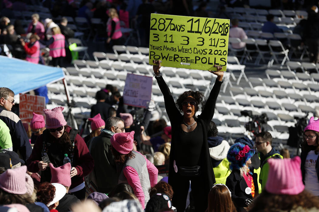 Nyla Christian, 50, dances and cheers before the Power to the Polls event, hosted by the Women's March, at the Sam Boyd Stadium in Las Vegas, Sunday, Jan. 21, 2018. The event, which served as an a ...