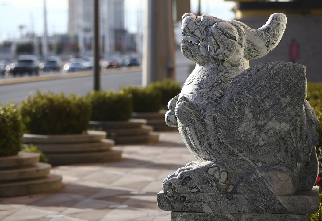 A statue outside of Lucky Dragon, which shut down gaming and casino restaurant operations in early Jan., in Las Vegas on Monday, Jan. 15, 2018. (Chase Stevens/Las Vegas Review-Journal) @csstevensphoto