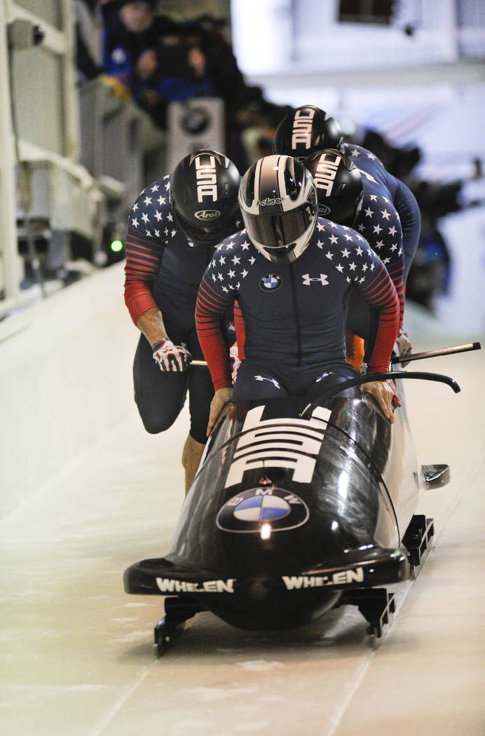 Driver Justin Olsen with Austin Landi, Luis Moreira and brakeman Evan Weinstock, of the United States, compete in the four-man bobsled World Cup race on Saturday, Dec. 17, 2016, in Lake Placid, N. ...