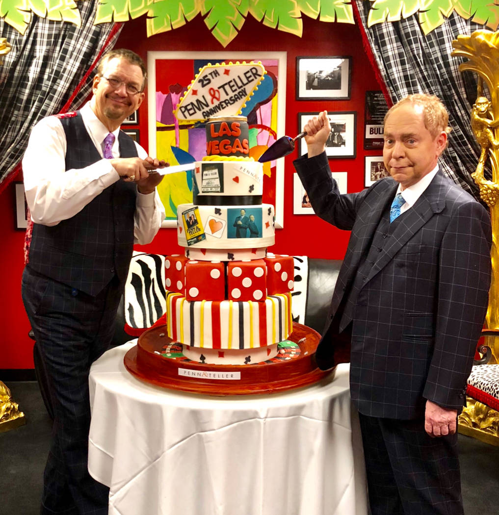 Penn & Teller are shown with a large cake at the RIo, commemorating their 25th anniversary of performing in Las Vegas, on Sunday, Jan. 14, 2018. (Glenn Alai)