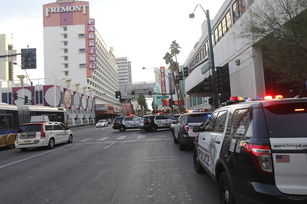 Cop cars on Ogden and Casino Center near the Fremont Street Experience in Las Vegas, Monday, Jan. 15, 2018. A large fight occurred nearby with around 100 people involved and eight were detained, a ...
