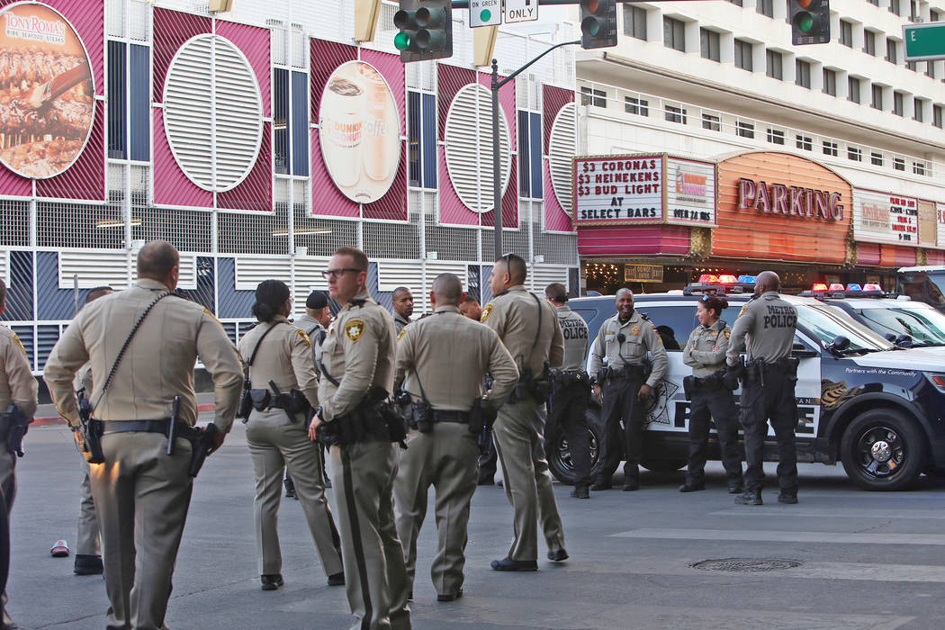 Metro police on Ogden and Casino Center near the Fremont Street Experience in Las Vegas, Monday, Jan. 15, 2018. A large fight occurred nearby with around 100 people involved and eight were detaine ...
