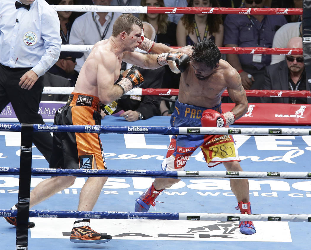 Jeff Horn of Australia, left, and Manny Pacquiao of the Philippines, right, lands a left to during their WBO World Welterweight title fight in Brisbane, Australia, Sunday, July 2, 2017.  Pacquiao  ...