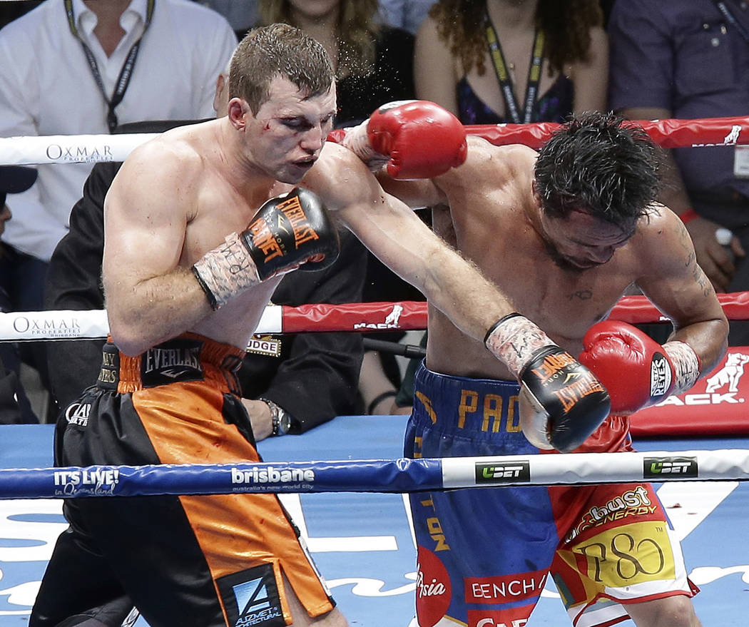 Jeff Horn of Australia, left, lands a left to Manny Pacquiao of the Philippines, right, during their WBO World Welterweight title fight in Brisbane, Australia, Sunday, July 2, 2017. Pacquiao lost  ...