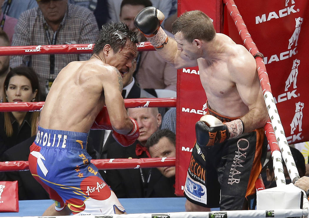 Jeff Horn of Australia, right, lands a right to  Manny Pacquiao of the Philippines, during their WBO World Welterweight title fight in Brisbane, Australia, Sunday, July 2, 2017.  Pacquiao lost his ...