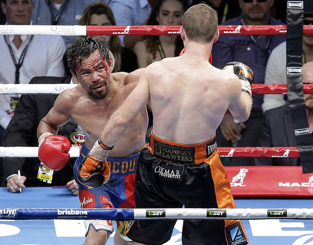 Manny Pacquiao of the Philippines, left, lands a left, to Jeff Horn of Australia, during their WBO World Welterweight title fight in Brisbane, Australia, Sunday, July 2, 2017. (AP Photo/Tertius Pi ...