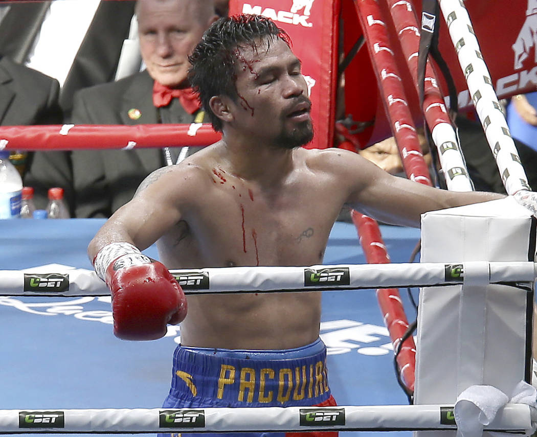 In this Sunday, July 2, 2017, file photo, Manny Pacquiao of the Philippines reacts after his loss to Jeff Horn of Australia, during their WBO World Welterweight title fight in Brisbane, Australia. ...