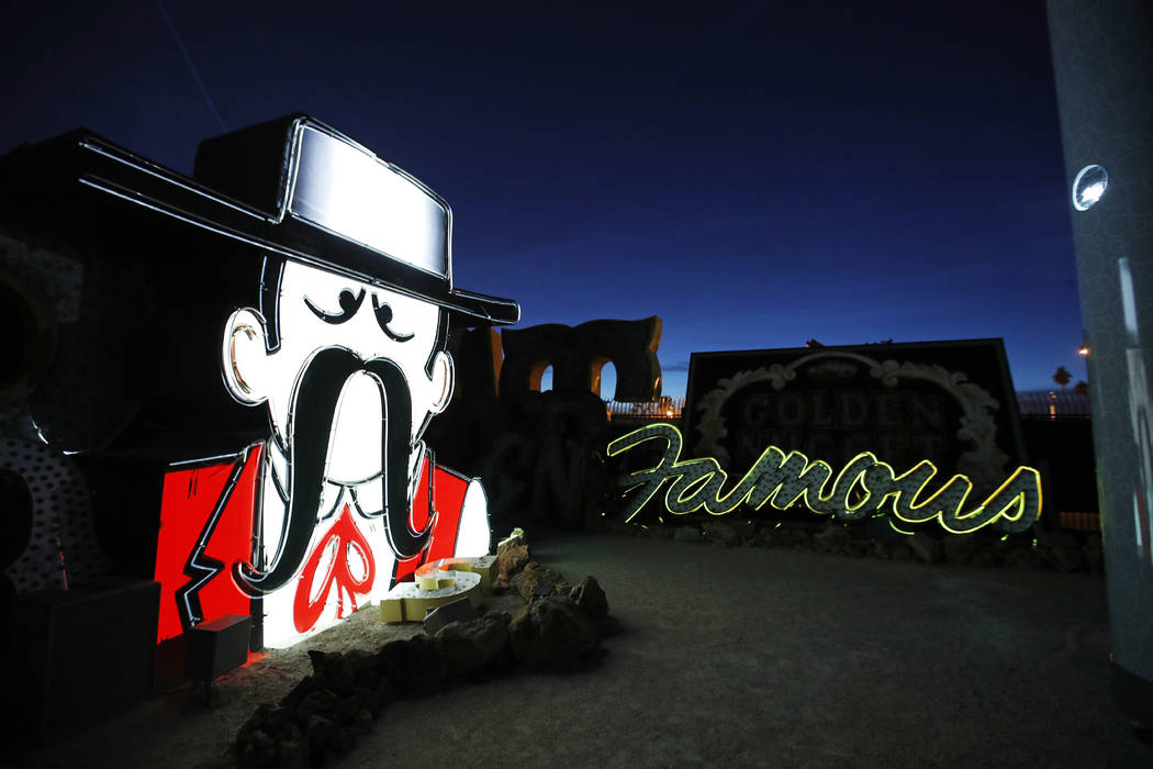 In this Jan. 24, 2018, photo, projectors light up non-working neon signs at an exhibit at the Neon Museum in Las Vegas. Starting this week, visitors will be able to see many of the city's classic  ...