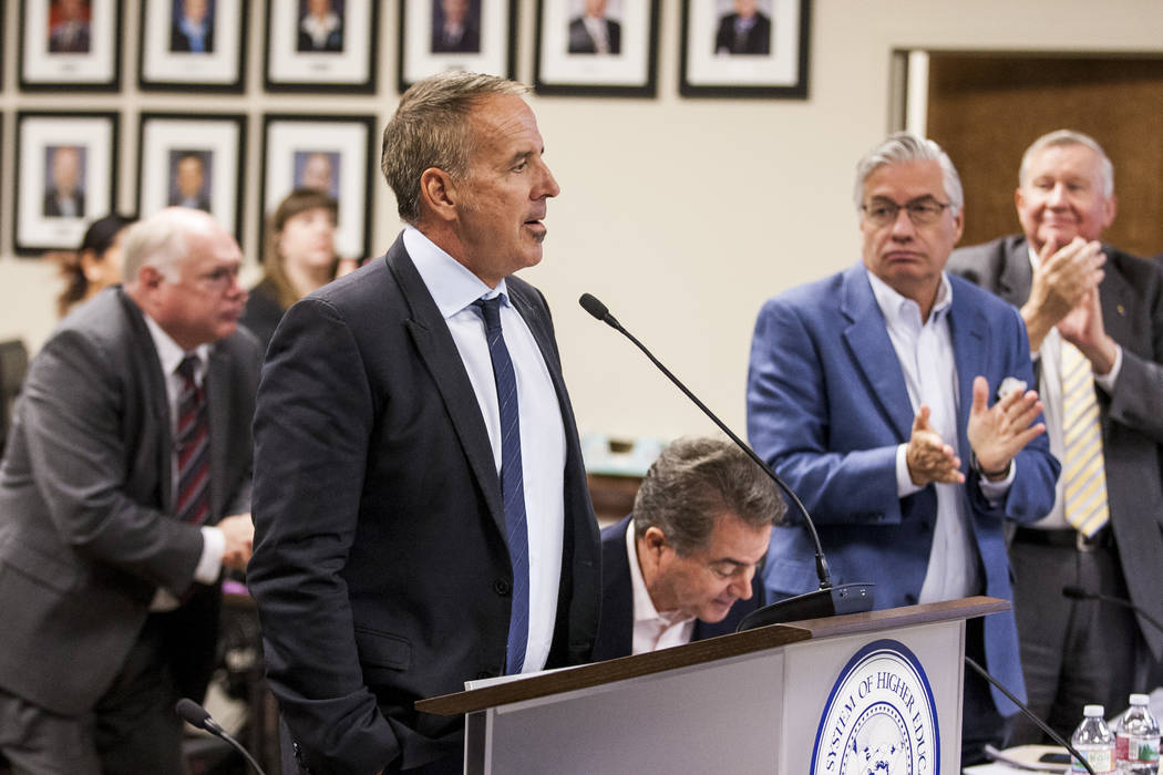 Thom Reilly, the newly appointed chancellor of the Nevada System of Higher Education, is applauded by the Board of Regents at a Board of Regents meeting in the NSHE office in Las Vegas on Monday,  ...