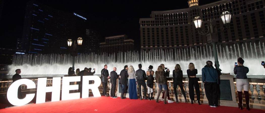 A look at Cher and a group of MGM Resorts International and AEG Live executives at the Bellagio Fountain show as it plays "Believe" on Wednesday, Jan. 17, 2018. (Tom Donoghue)