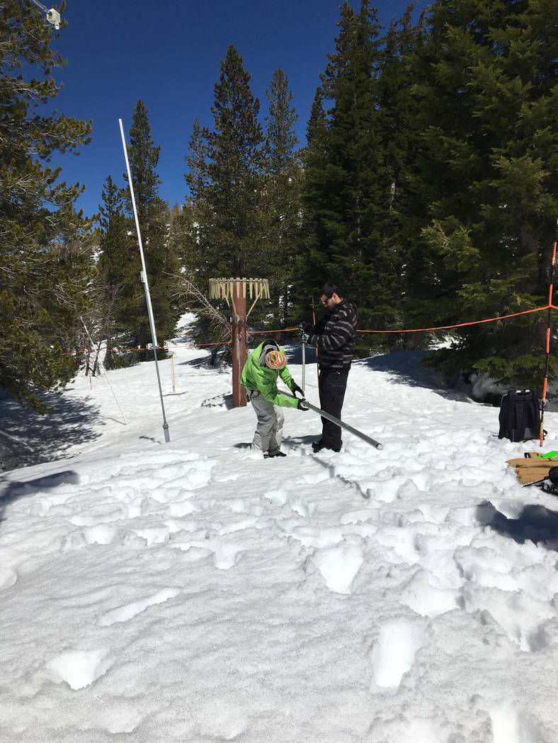 Desert Research Institute scientist Benjamin Hatchett, right, and student Shawn Roj measure snowpack at Mount Rose Ski Area near Reno in an undated photo. Siani Nau