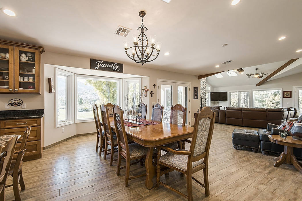 Throughout the home at 9590 Mule Deer Road there is wood-look tile flooring. (Realty One Group)
