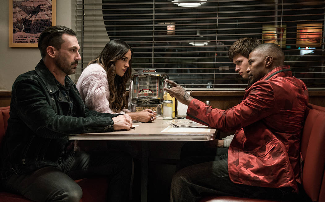 Buddy (Jon Hamm), Darling (Eiza Gonzalez), Baby (Ansel Elgort) and Bats (Jamie Foxx) discuss the next heist in TriStar Pictures' "Baby Driver."