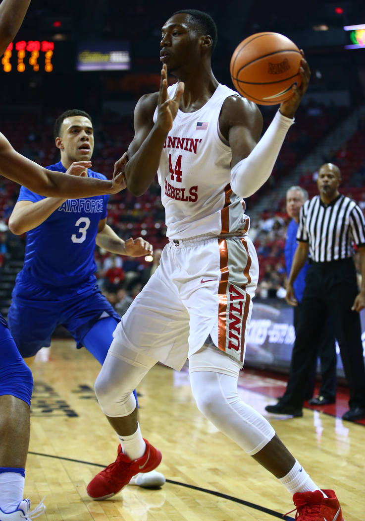 UNLV Rebels forward Brandon McCoy (44) takes the ball past Air Force Falcons guard Sid Tomes (3) during a basketball game at the Thomas & Mack Arena in Las Vegas on Wednesday, Feb. 14, 2018. C ...