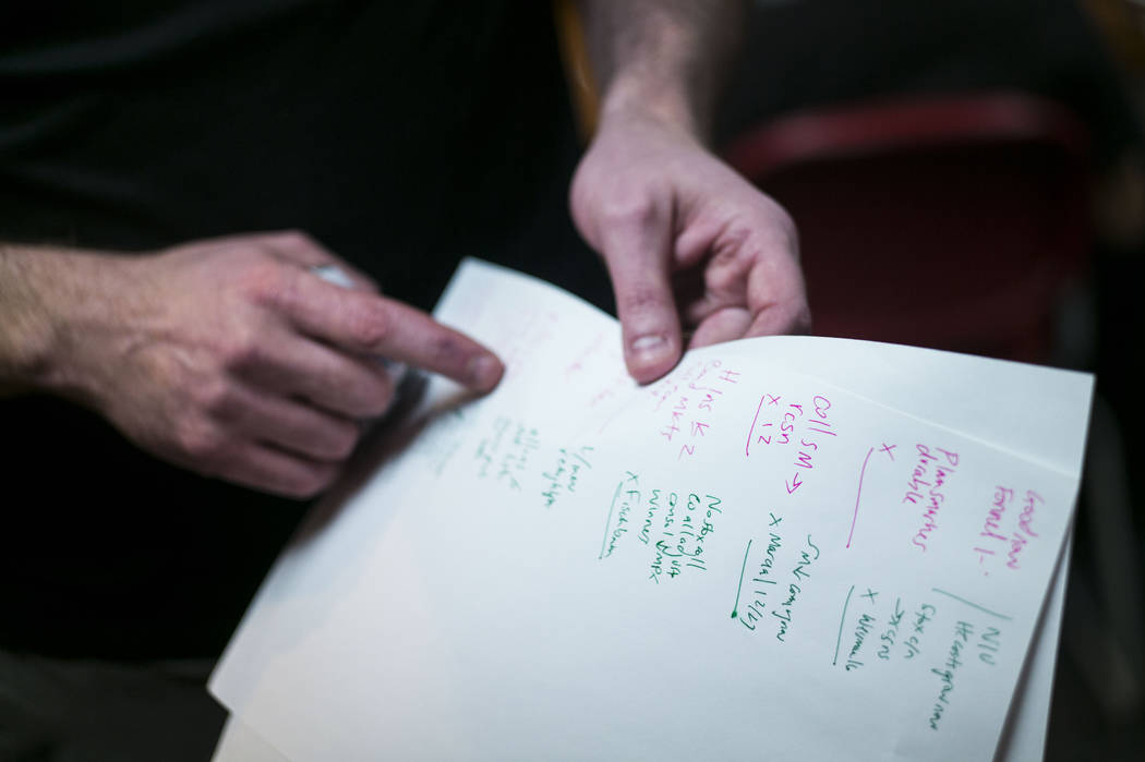 Jacob Thompson, director of the UNLV Debate Team, points to his notes from practice during a group meeting at UNLV in Las Vegas on Wednesday, Jan. 31, 2018. The team is ranked as one of the top de ...