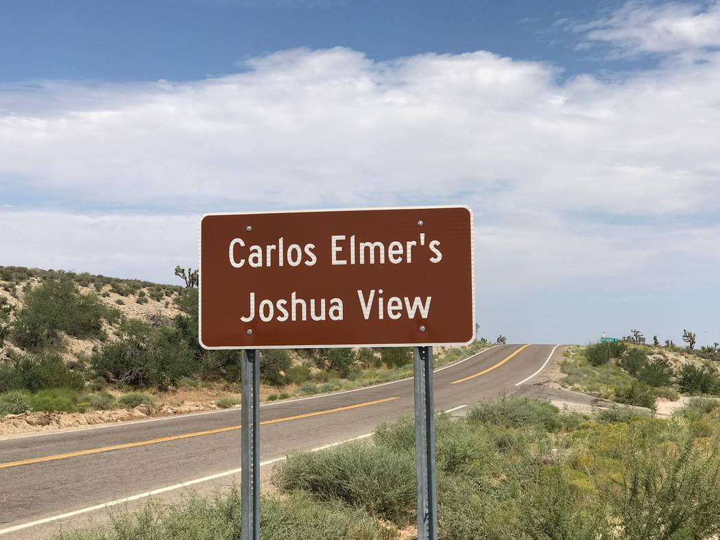 A sign points the way to Carlos Elmer's Joshua View in northwestern Arizona, about 105 miles southeast of Las Vegas. The viewpoint is one of just five place names nationwide that officially contai ...