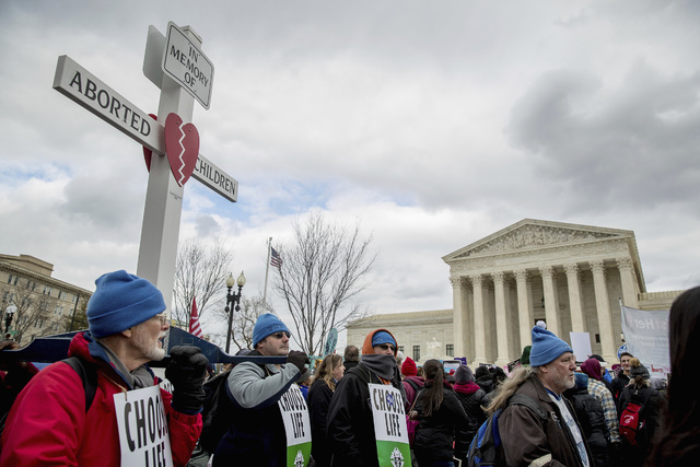 Pro-life activists converge in front of the Supreme Court in Washington, Friday, Jan. 27, 2017, during the annual March for Life. Thousands of anti-abortion demonstrators gathered in Washington fo ...