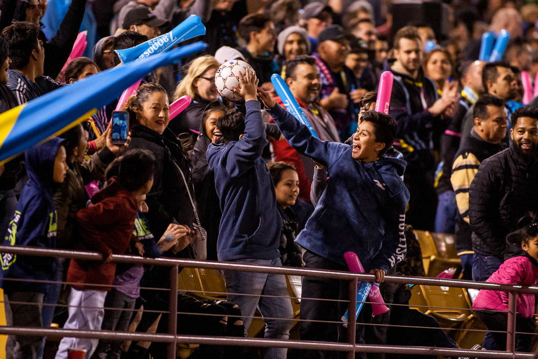 An excited fan catches a stray ball during the first Las Vegas Lights FC game playing against the Montreal Impact at Cashman Field in Las Vegas on Saturday, Feb. 10, 2018.  Patrick Connolly Las Ve ...