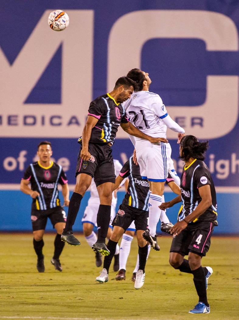 Players compete for a head butt during the first Las Vegas Lights FC game playing against the Montreal Impact at Cashman Field in Las Vegas on Saturday, Feb. 10, 2018.  Patrick Connolly Las Vegas  ...